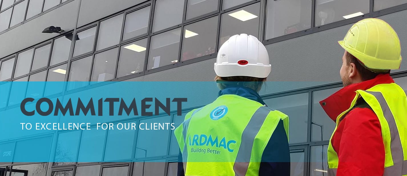 ardmac-excellence in construction - yellow helmet - meet the team Ardmac - Two construction workers viewing a building